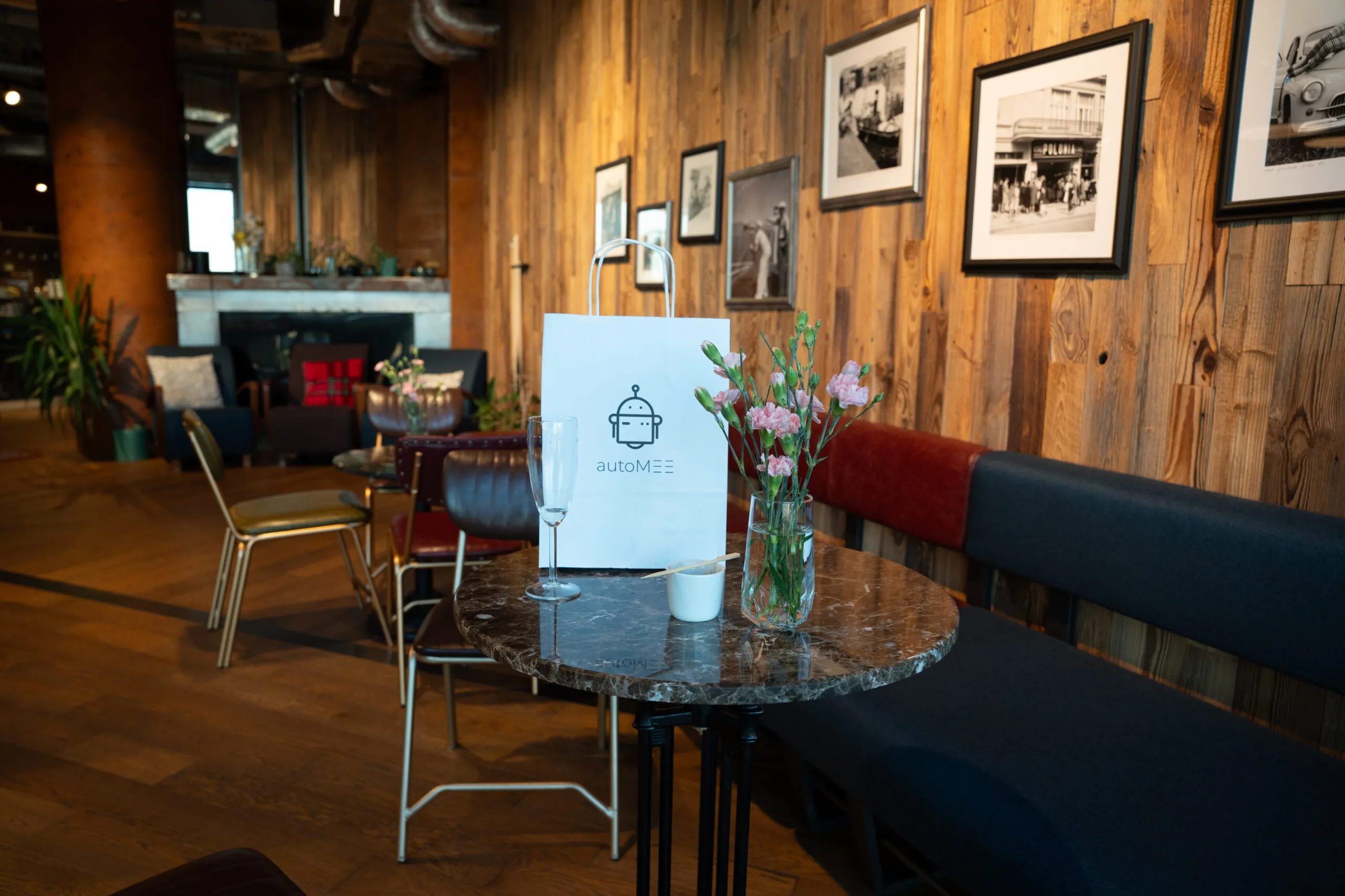 Cozy cafe interior with table and flowers.